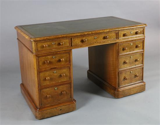 A Victorian walnut pedestal desk, W.4ft D.2ft 4in. H.2ft 6in. A Victorian walnut pedestal desk, W.4ft D.2ft 4in. H.2ft 6in.