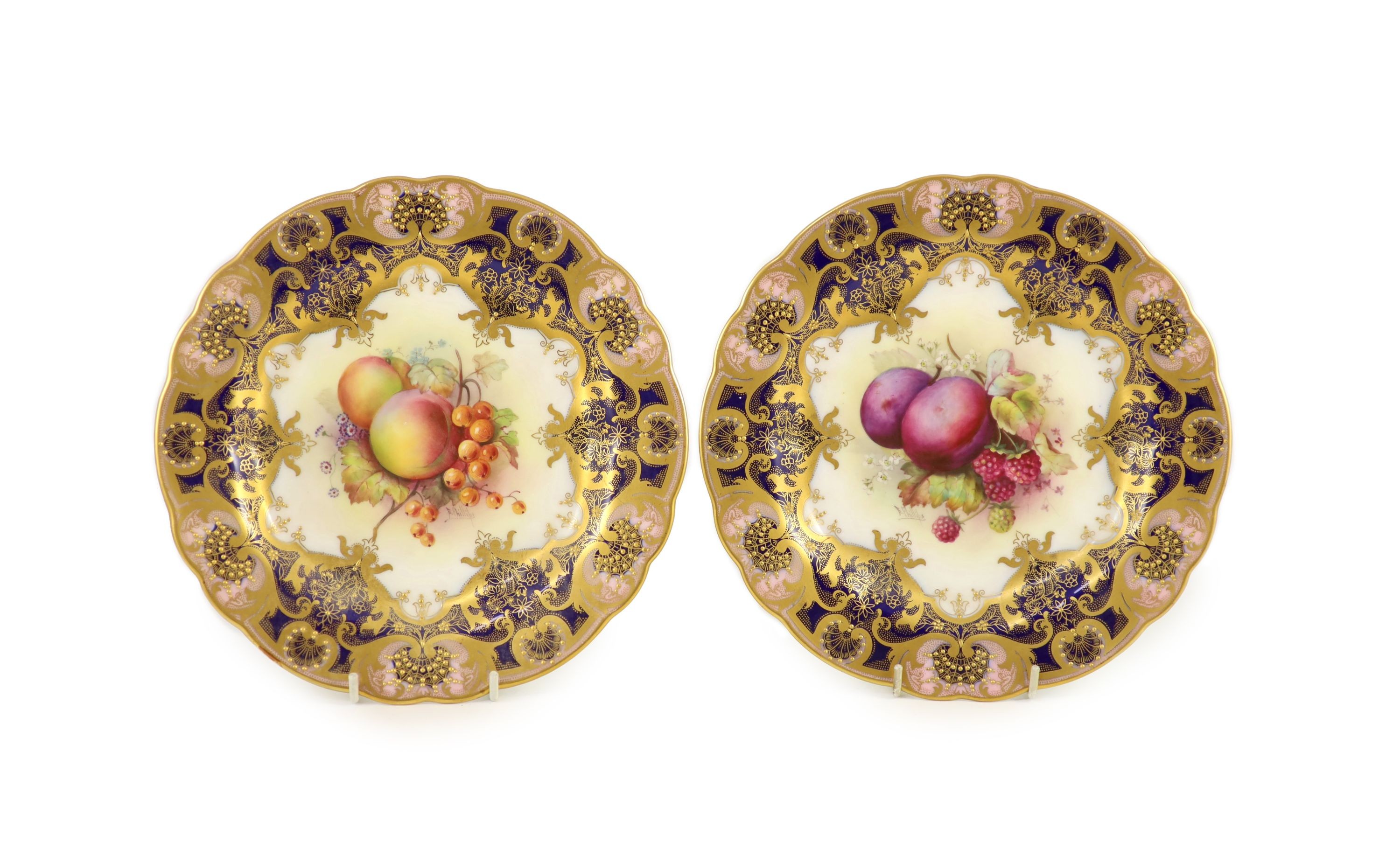 A pair of Royal Worcester fruit painted dessert plates, signed E. Phillips, c.1918, 22.5cm diameter