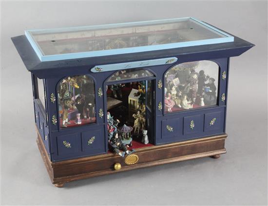 A Camus musical automaton modelled as a doll makers shop La Voule, width 37in. height 23in. depth 19in. A Camus musical automaton modelled as a doll makers shop La Voule, width 37in. height 23in. depth 19in.