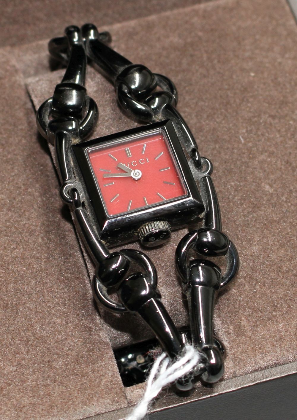 A ladys blackened steel Gucci Signora quartz wrist watch,