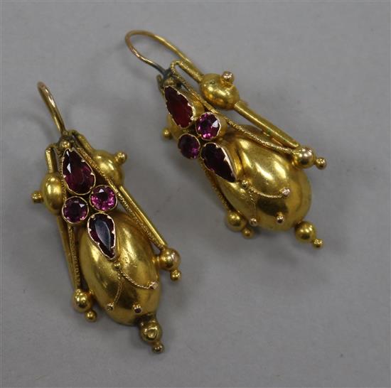 A pair of Victorian yellow metal and garnet set tapered earrings, overall incl. wire 40mm. A pair of Victorian yellow metal and garnet set tapered earrings, overall incl. wire 40mm.