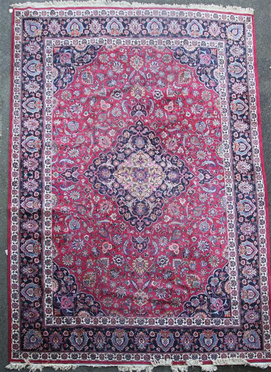 A Meshed red and blue ground, carpet 5.03 x 3.43 5.03 metres by 3.43 metres. A Meshed red and blue ground, carpet 5.03 x 3.43 5.03 metres by 3.43 metres.