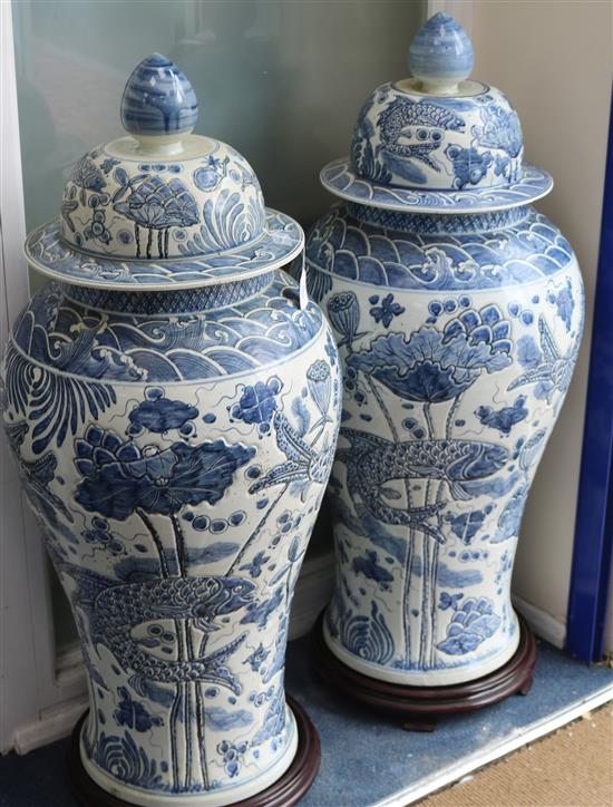 A pair of Chinese 20th century blue and white large floor vases and covers, H approx 118cm A pair of Chinese 20th century blue and white large floor vases and covers, H approx 118cm