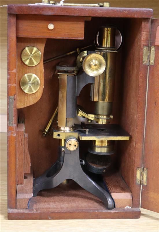 A 19th century mahogany cased microscope A 19th century mahogany cased microscope