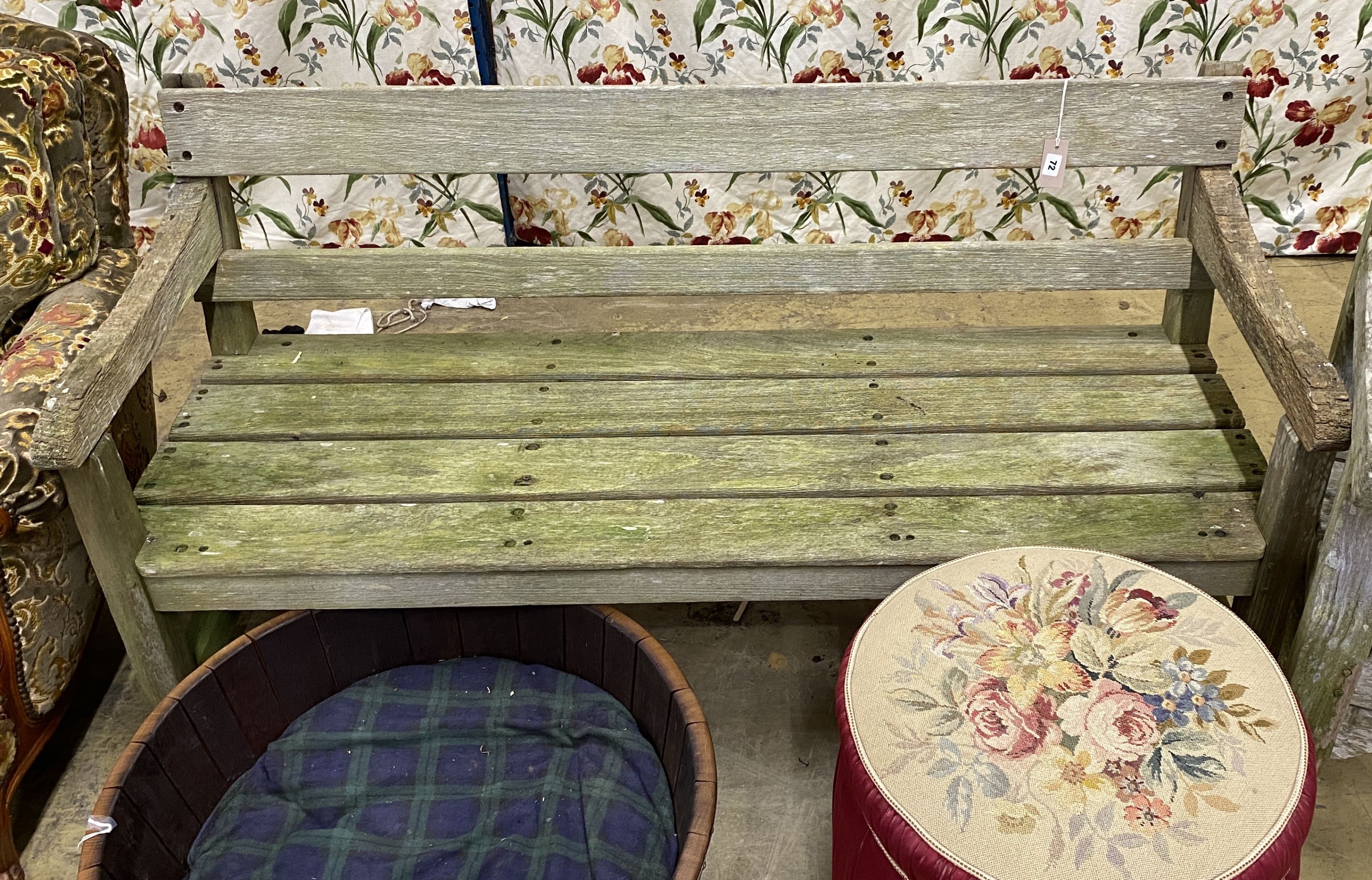 A weathered teak garden bench, length 150cm, depth 54cm, height 78cm