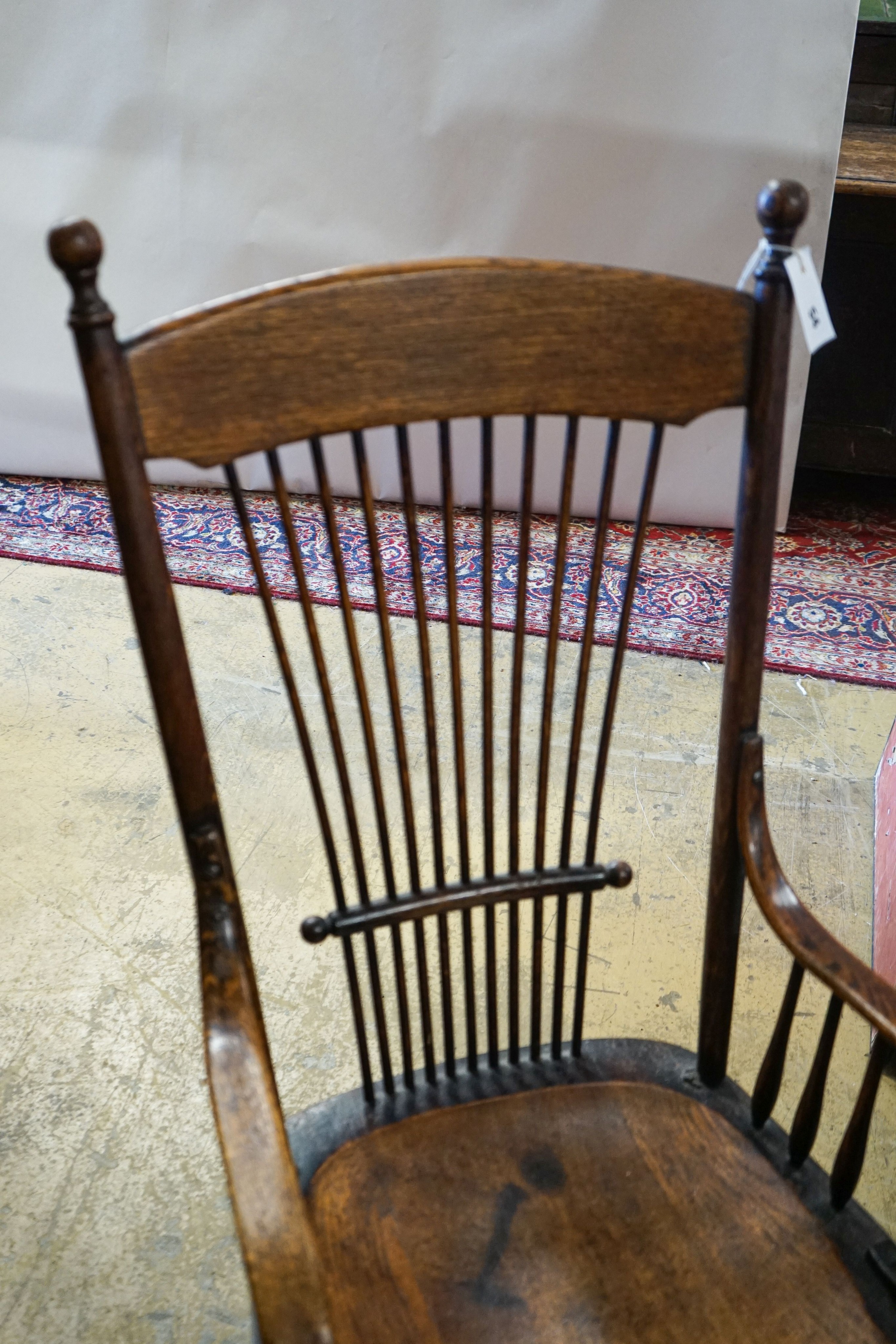 An early 20th century American ash and oak elbow chair, width 52cm, depth 42cm, height 100cm