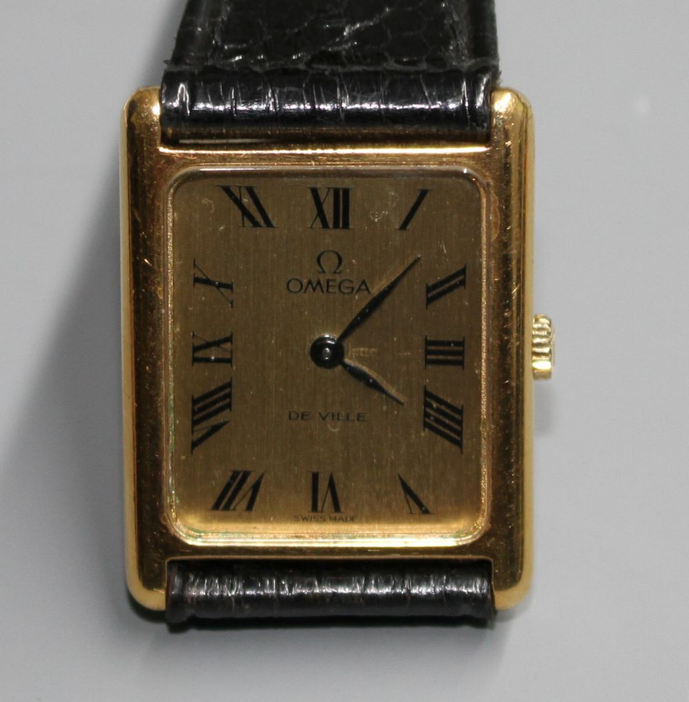 A gentlemans gold plated Omega De Ville quartz dress wrist watch, on associated strap.
