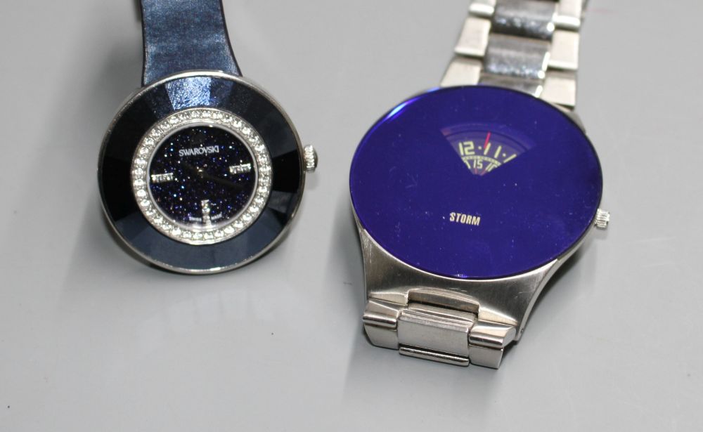 Two gentlemans modern wrist watches, Storm and Swarovski.