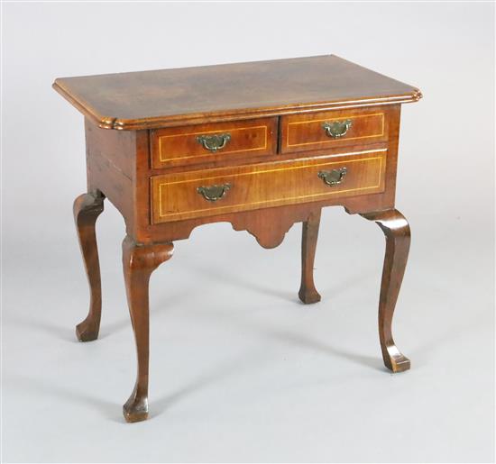 An early 18th century walnut lowboy, W.2ft 6in. D.1ft 7in. H.2ft 3in. An early 18th century walnut lowboy, W.2ft 6in. D.1ft 7in. H.2ft 3in.