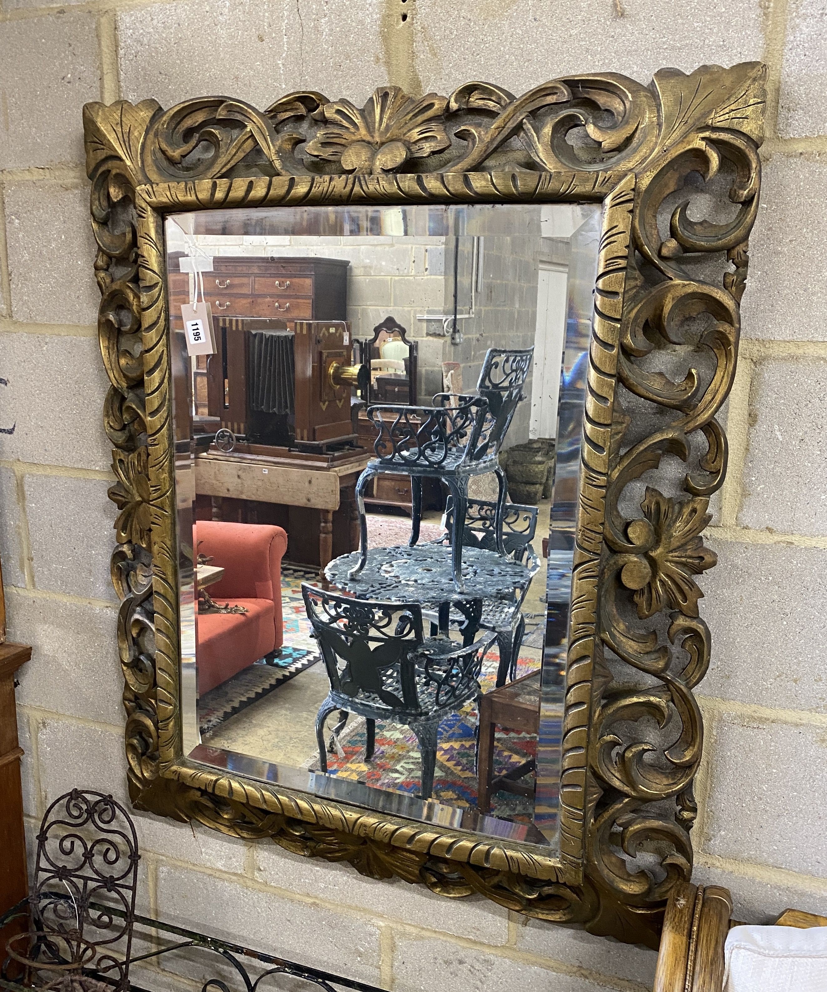A Victorian carved giltwood wall mirror, width 94cm, height 114cm