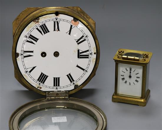 A brass carriage clock and brass ships bulkhead clock