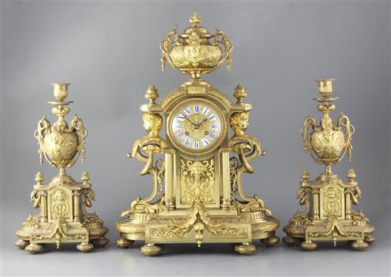 A third quarter of the 19th century French ormolu clock garniture, 20.5in. A third quarter of the 19th century French ormolu clock garniture, 20.5in.