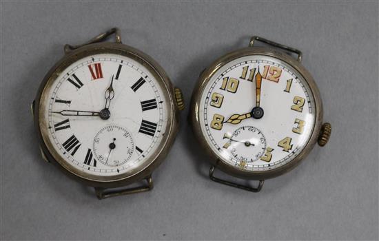An early 20th century silver military wrist watch and one other early 20th century silver wrist watch (no straps). An early 20th century silver military wrist watch and one other early 20th century silver wrist watch (no straps).