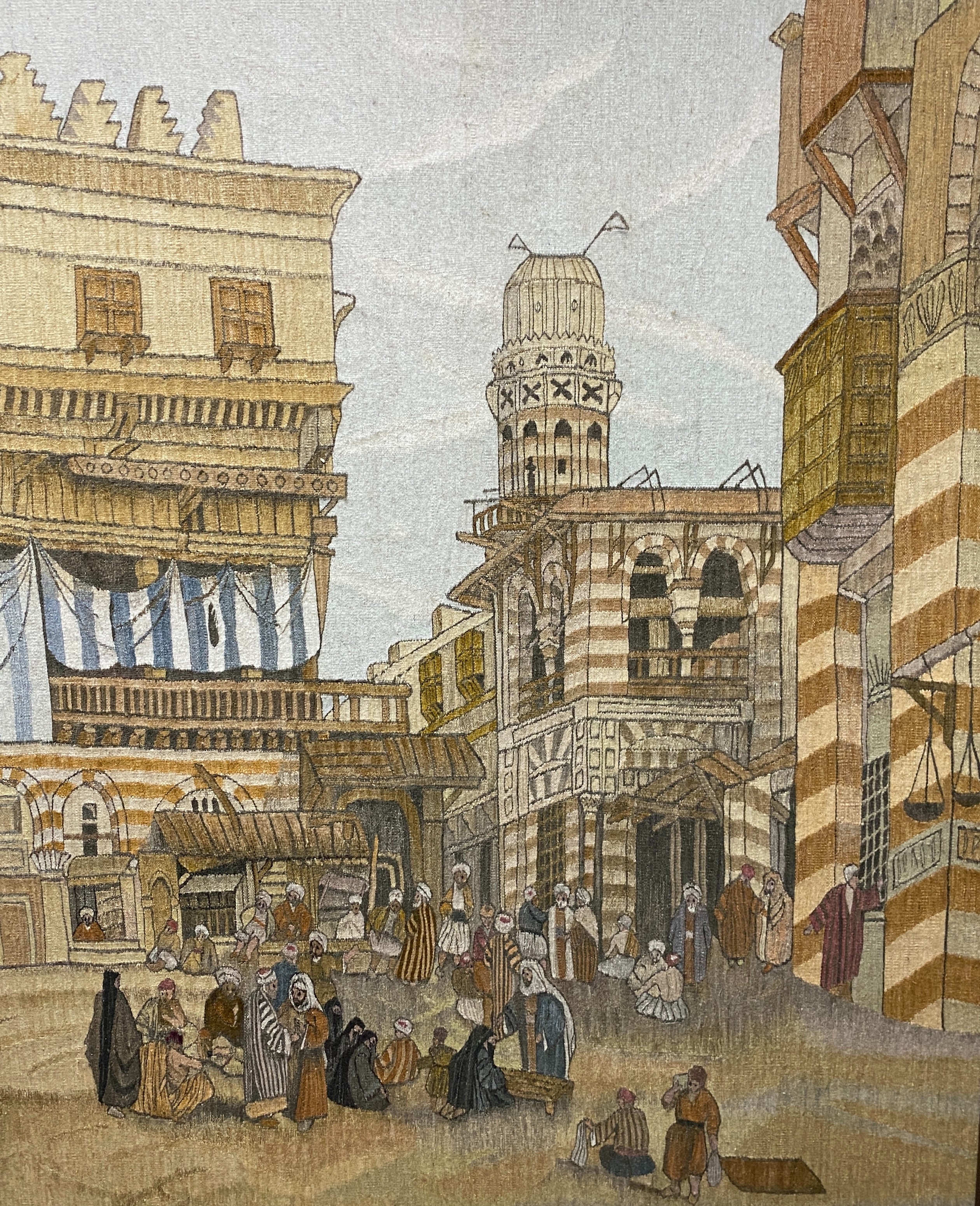 An early 20th century handwoven tapestry of a North African market scene, height 160cm width 134cm