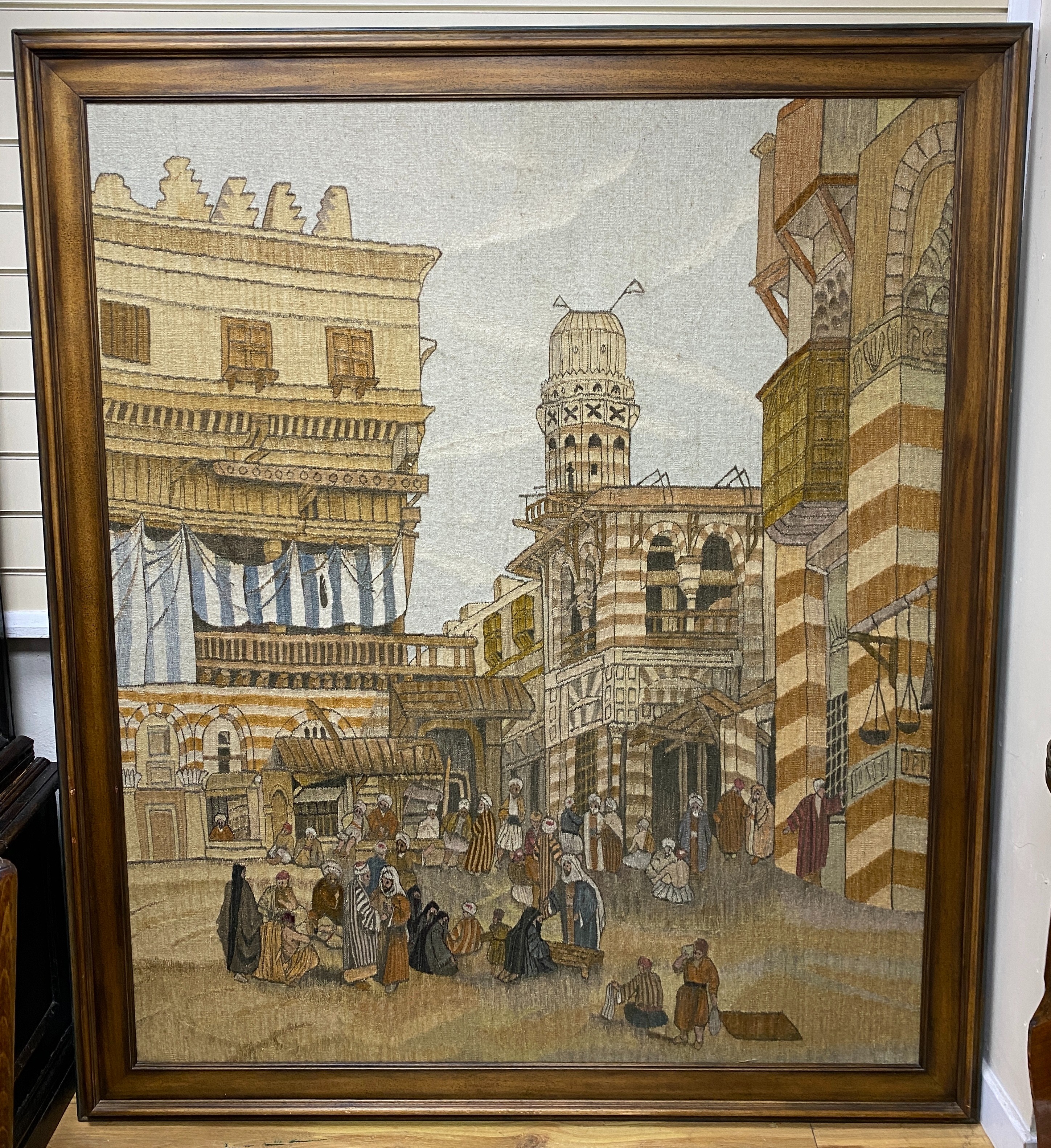 An early 20th century handwoven tapestry of a North African market scene, height 160cm width 134cm