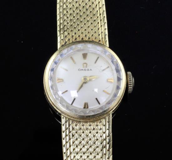 A ladys 18ct gold Omega manual wind wrist watch, on integral 18ct gold Omega bracelet. A ladys 18ct gold Omega manual wind wrist watch, on integral 18ct gold Omega bracelet.