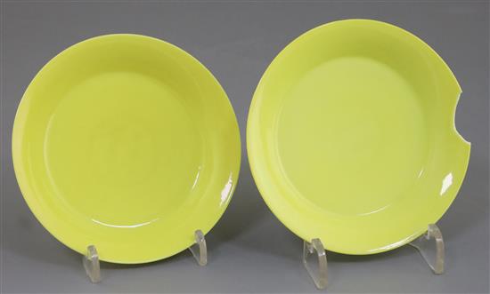A fine pair of Chinese lemon yellow saucer dishes, Yongzheng mark and possibly of the period, D. 10.8cm, one with section broken, secon