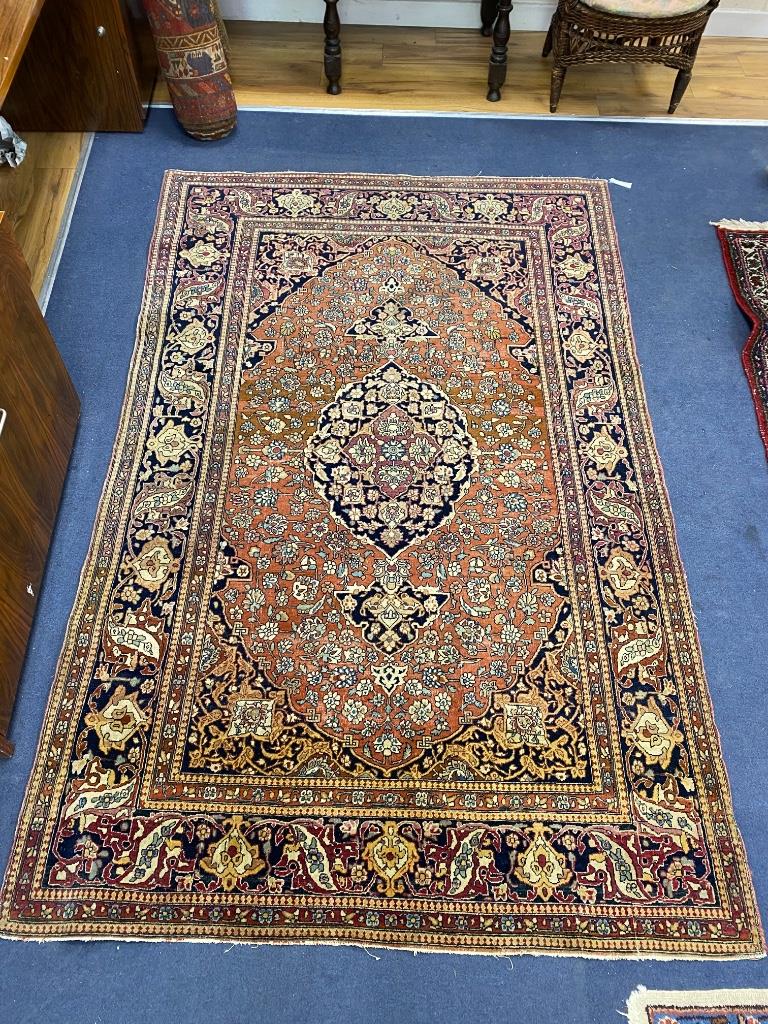 A Kashan red ground rug, 224 x 138cm
