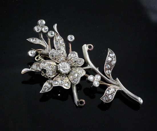 A 19th century gold, silver and diamond floral spray brooch, 60mm. A 19th century gold, silver and diamond floral spray brooch, 60mm.
