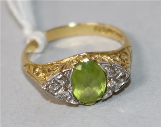 An 18ct gold, peridot and diamond cluster ring, size N. An 18ct gold, peridot and diamond cluster ring, size N.