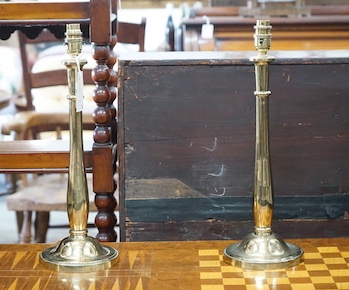 A pair of heavy brass table lamps, height 44cm
