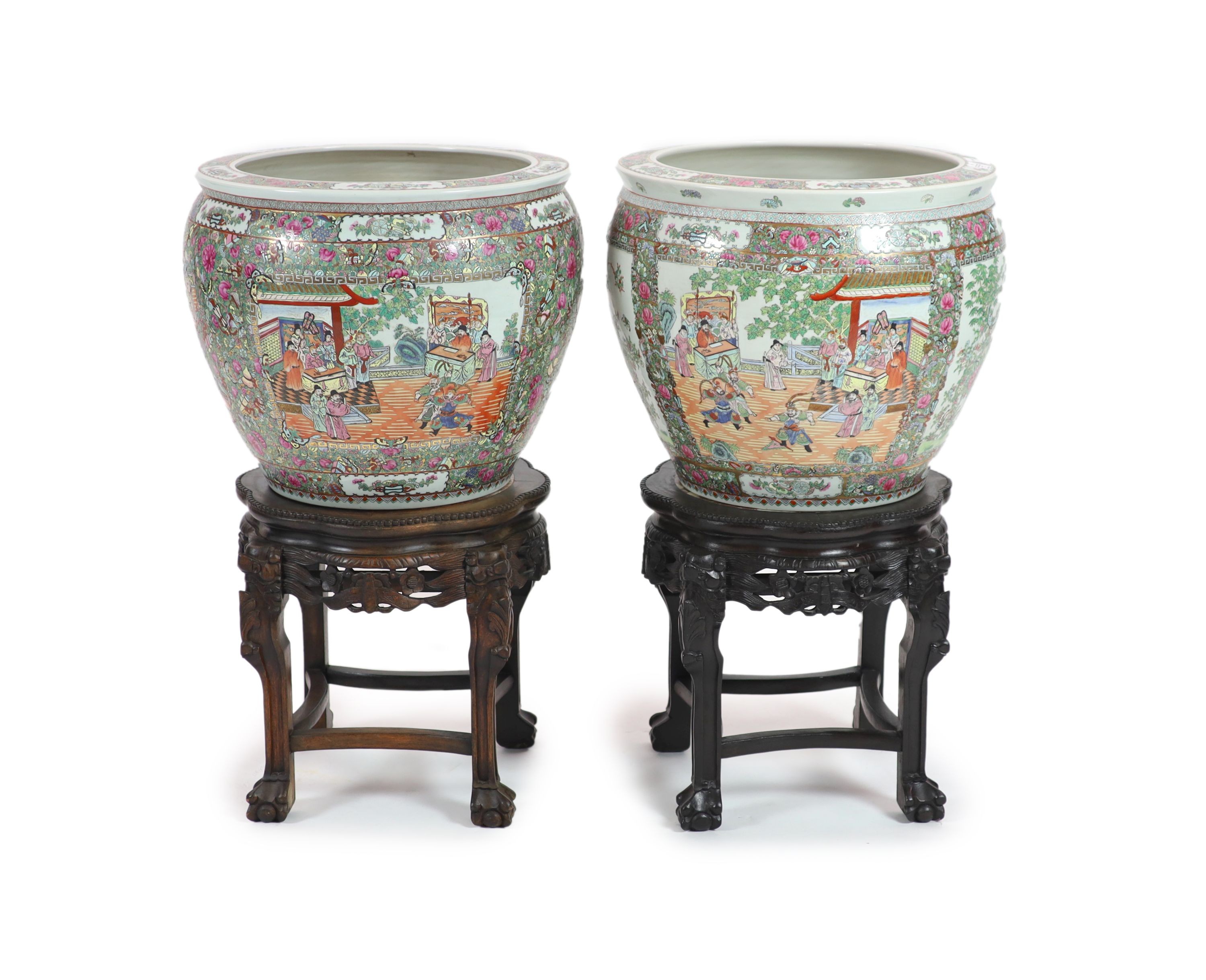 A pair of Chinese famille rose ‘goldfish’ bowls, 56cm diameter, with ebonised and marble inset stands, total height 91cm