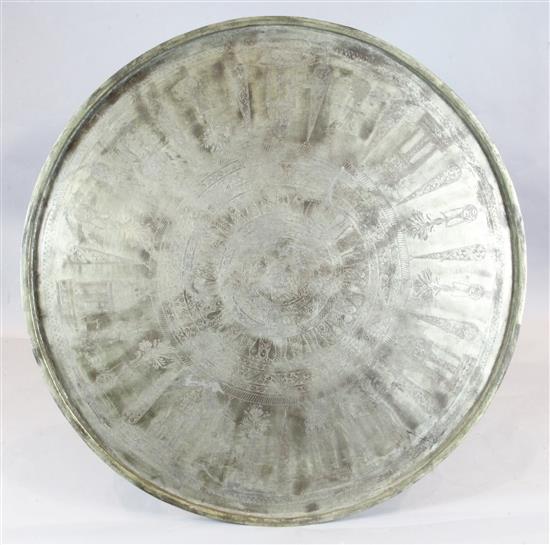 A monumental brass tray, probably Syria or Western Armenia, late 19th century, diameter 56.75in. A monumental brass tray, probably Syria or Western Armenia, late 19th century, diameter 56.75in.