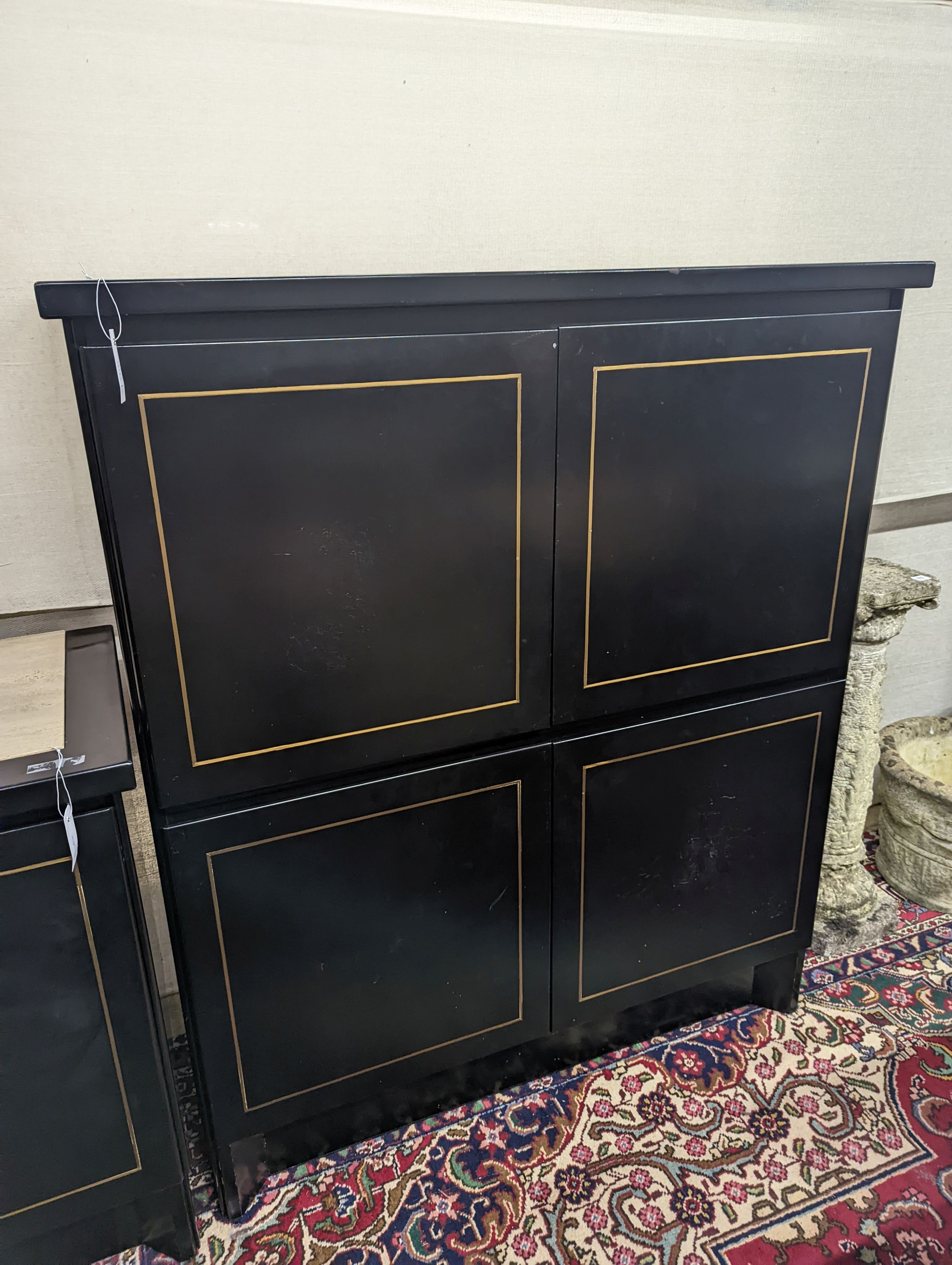 A 20th century black lacquer four door side cabinet, width 115cm, depth 45cm, height 135cm