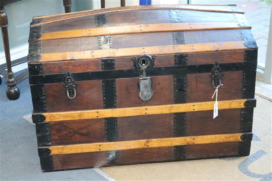 A wood and leather bound dome top steamer trunk W.92cm A wood and leather bound dome top steamer trunk W.92cm