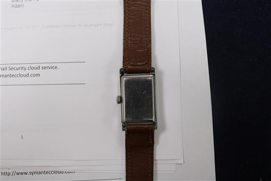 A gentlemans steel Cyma rectangular dial manual wind wrist watch, two silver fob watches and a nickel cased pocket watch. A gentlemans steel Cyma rectangular dial manual wind wrist watch, two silver fob watches and a nickel cased pocket watch.