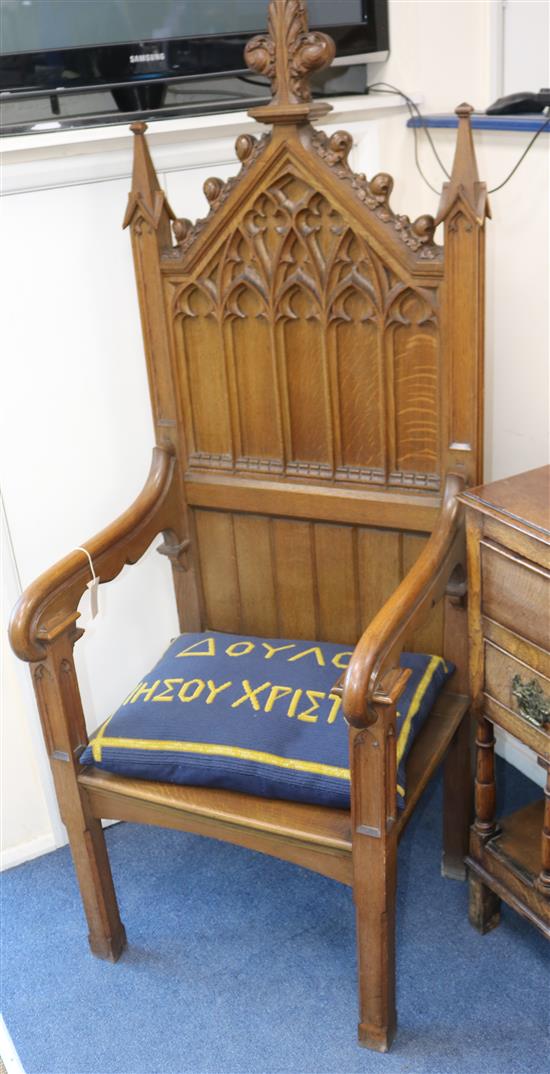 A Gothic style oak throne chair A Gothic style oak throne chair