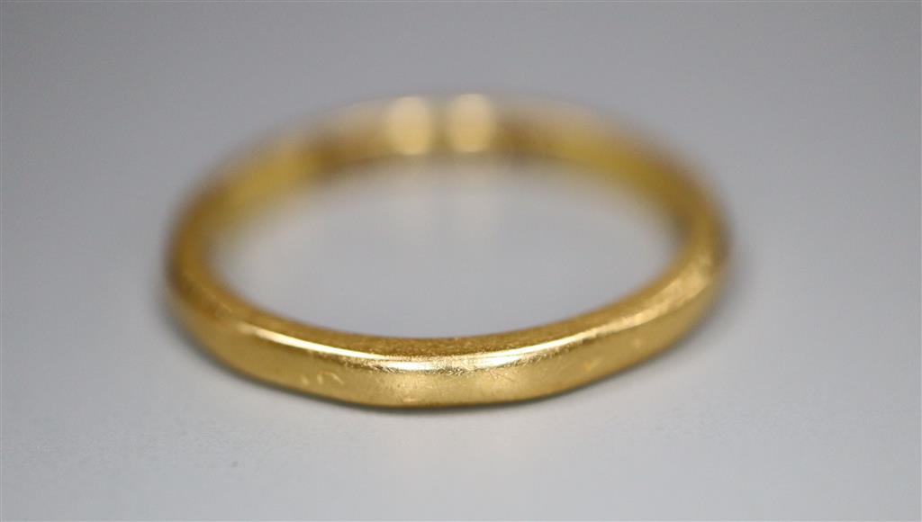 A 22ct gold wedding band, size K, 2.4 grams.