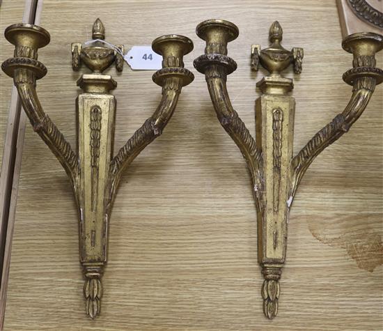 A pair of Louis XVI style carved giltwood two branch wall sconces height 42cm A pair of Louis XVI style carved giltwood two branch wall sconces height 42cm