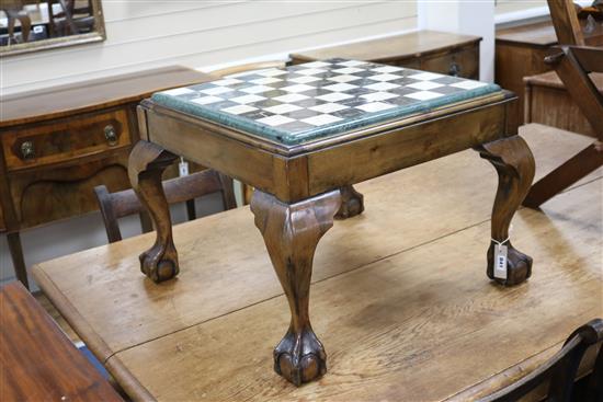 A marble top chessboard on a claw and ball feet base W.64cm A marble top chessboard on a claw and ball feet base W.64cm