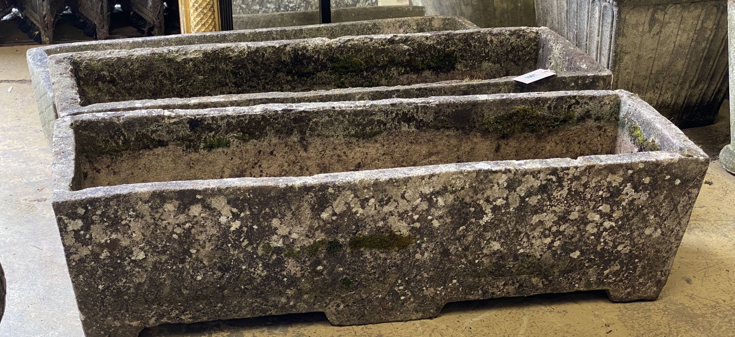 Three rectangular reconstituted stone garden planters, one lacking base, largest width 91cm, height 26cm
