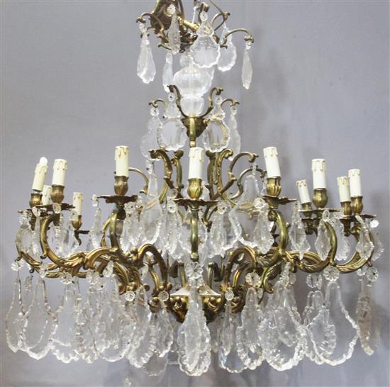 A gilt metal and cut glass fifteen light chandelier, width 36in. A gilt metal and cut glass fifteen light chandelier, width 36in.