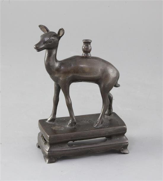 A Chinese bronze deer joss stick holder, 18th century, height 15cm A Chinese bronze deer joss stick holder, 18th century, height 15cm