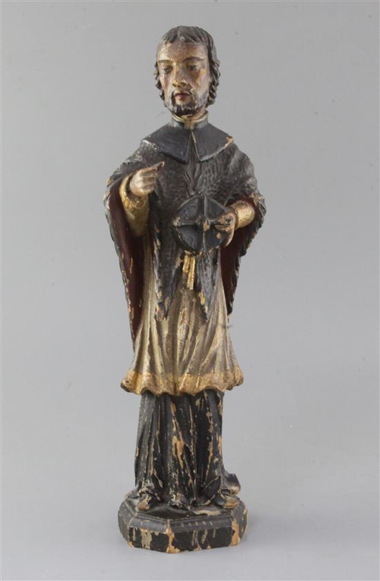 A 15th century German polychrome on wood figure of St. Nepomuk, 15in. A 15th century German polychrome on wood figure of St. Nepomuk, 15in.