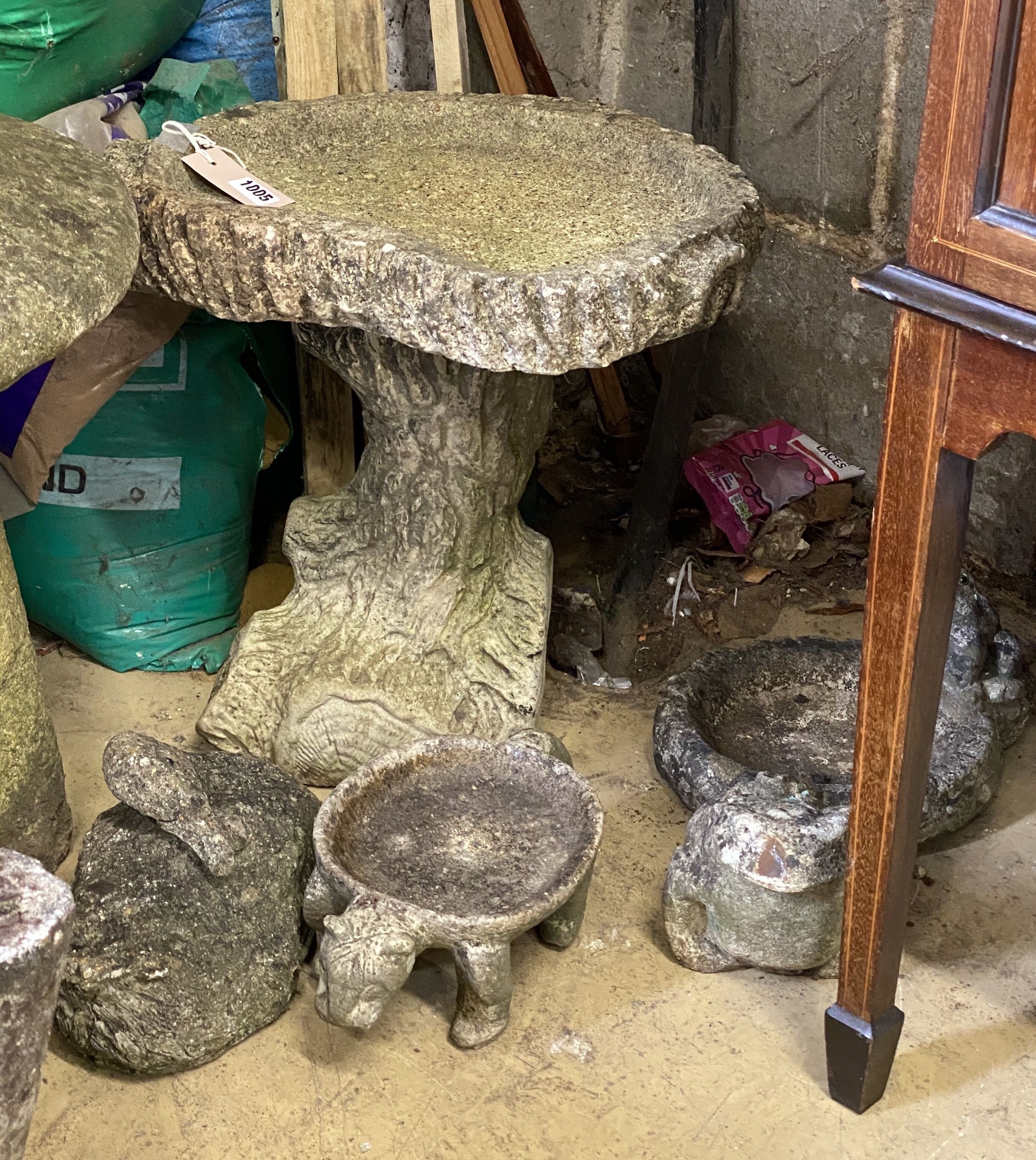 A reconstituted stone garden bird bath, width 44cm, height 43cm together with four small reconstituted stone garden ornaments