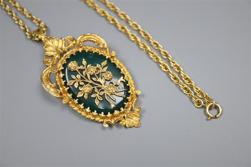 A 1970s 9ct gold and chrysophase set oval flower and scroll pendant brooch, on a multi-link 9ct chain,