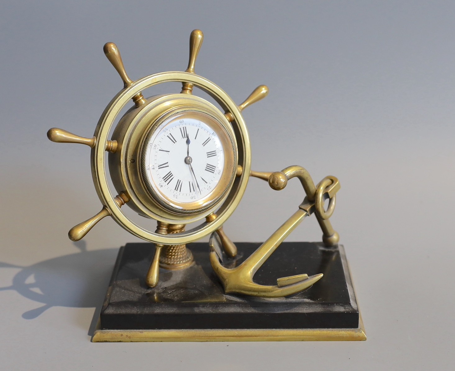 A Victorian brass and black slate nautical themed desk timepiece, width 19cm height 20cm