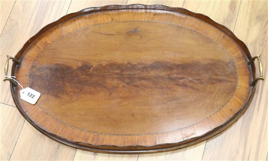 A George III satinwood banded mahogany two handled tea tray width 68cm A George III satinwood banded mahogany two handled tea tray width 68cm
