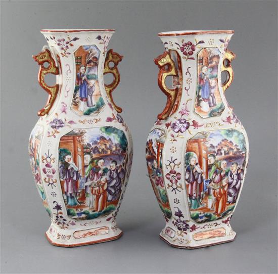 A pair of Chinese famille rose Mandarin hexagonal baluster vases, Qianlong period, height 27.5cm, slight damage A pair of Chinese famille rose Mandarin hexagonal baluster vases, Qianlong period, height 27.5cm, slight damage