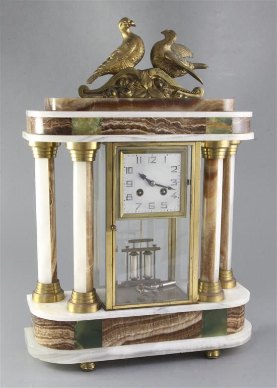 A 1930s polychrome onyx portico mantel clock, height 53cm A 1930s polychrome onyx portico mantel clock, height 53cm