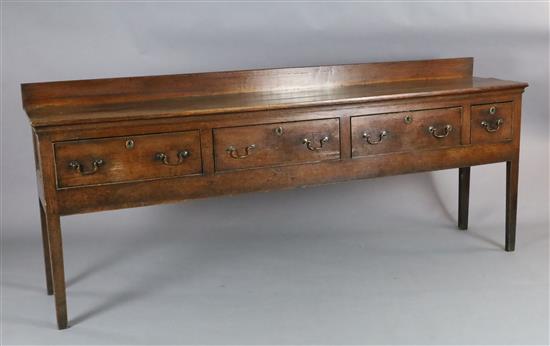 A George III oak dresser base, W.7ft 8in. D.1ft 7in. H.3ft 2in. A George III oak dresser base, W.7ft 8in. D.1ft 7in. H.3ft 2in.