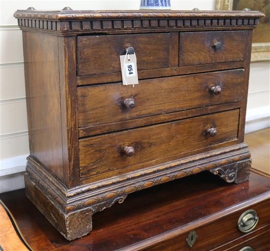 A North Italian walnut small chest of drawers W.65cm A North Italian walnut small chest of drawers W.65cm