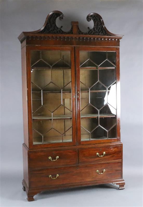 A George III mahogany display cabinet, W.4ft 7in. D.1ft 8in. H.8ft 3in. A George III mahogany display cabinet, W.4ft 7in. D.1ft 8in. H.8ft 3in.