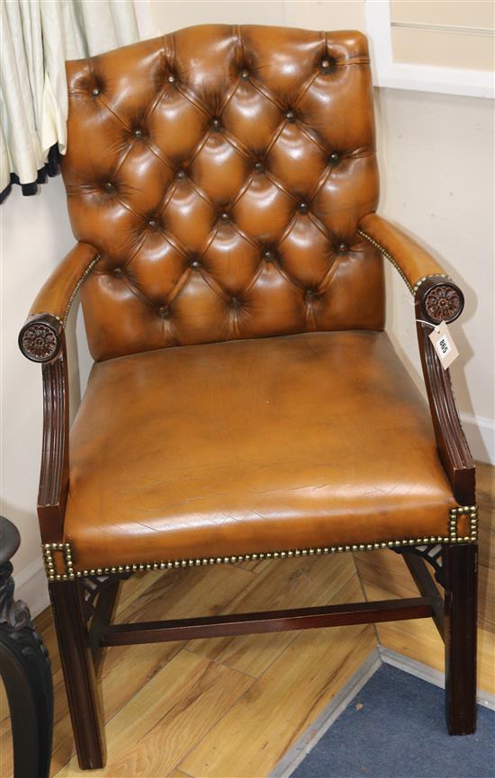 A mahogany framed leather button back Gainsborough armchair A mahogany framed leather button back Gainsborough armchair