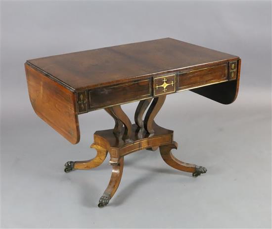 A Regency brass inset rosewood sofa table, W.3ft 3in. D.2ft 2in. H.2ft 4in. A Regency brass inset rosewood sofa table, W.3ft 3in. D.2ft 2in. H.2ft 4in.