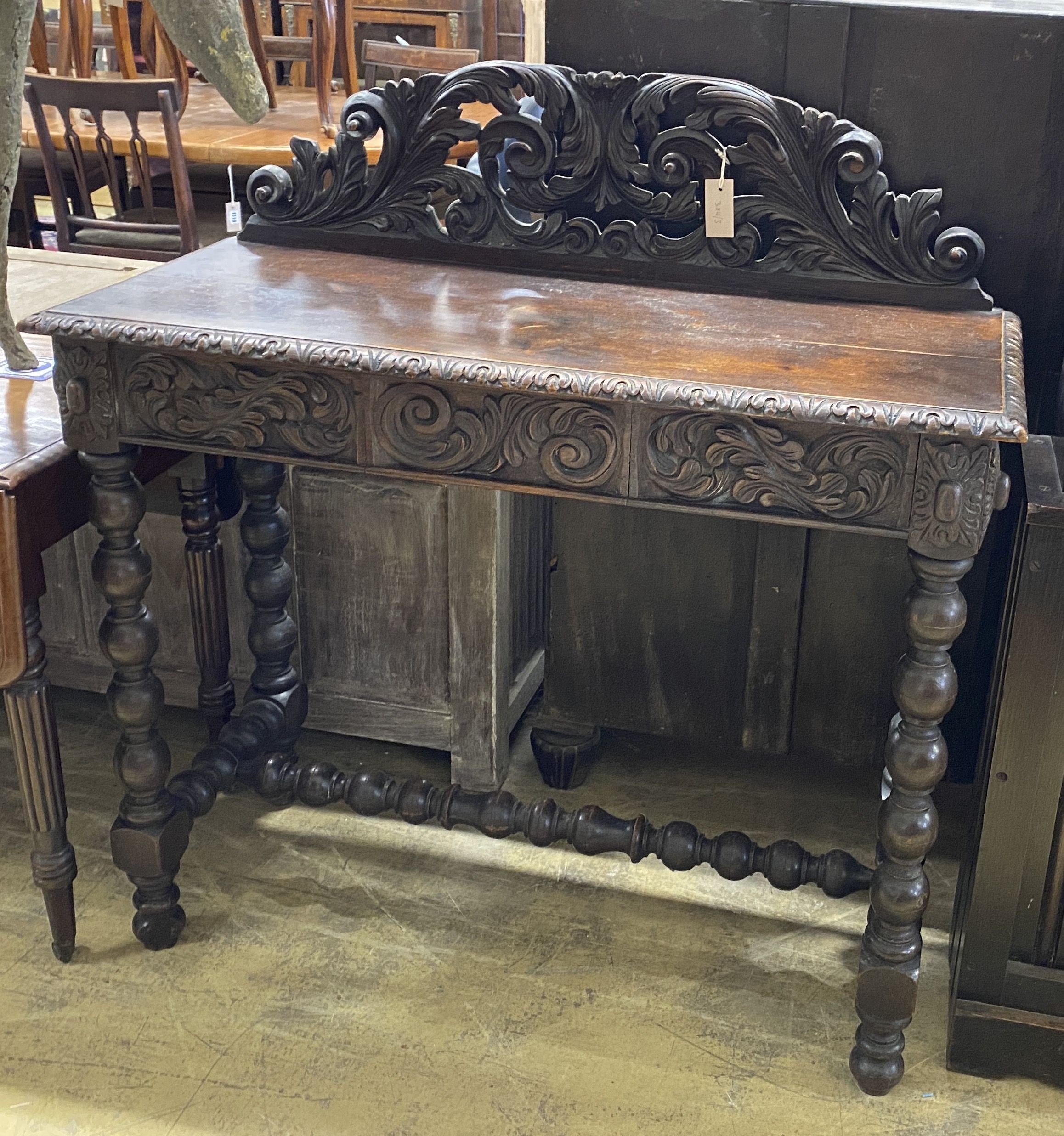 A Victorian carved oak console table, width 106cm, depth 45cm, height 111cm